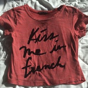 Striped crop top. Black writing is velvet.